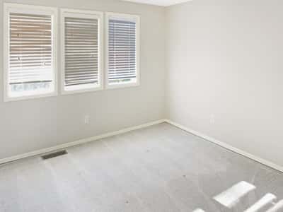 Upstairs find the 3rd bedroom. Bright and inviting room with ample natural light, ready for your personal touch and creative design.