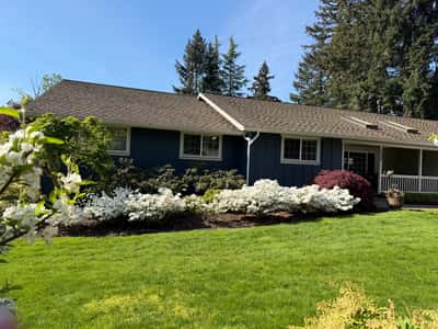 This well-maintained home features lush landscaping and ample natural light in a tranquil neighborhood setting.