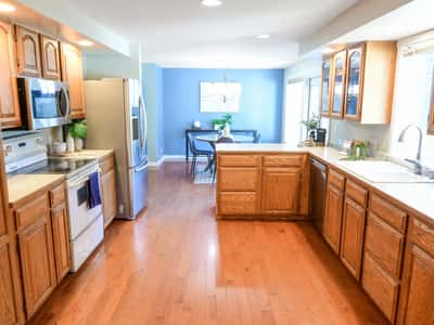Bright and spacious kitchen featuring ample storage, modern appliances, and seamless flow to the dining area.