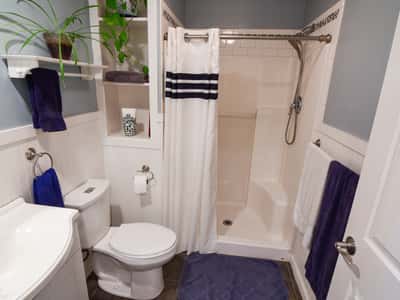 Bright and functional bathroom featuring modern fixtures, ample storage, and fresh color accents for a welcoming feel.