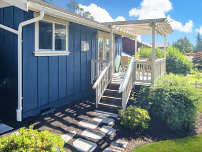 Discover this inviting home featuring a welcoming porch, landscaped yard, and abundant natural light.