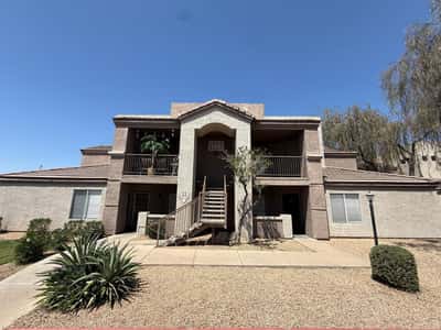 Well-maintained condominium building featuring attractive architecture, covered walkways, and desert-friendly landscaping. This inviting Phoenix community offers curb appeal and convenient low-maintenance living.