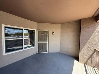Large covered balcony offers a comfortable outdoor living space with room for seating and relaxation. Enjoy fresh air and private outdoor enjoyment in this desirable Phoenix condo.