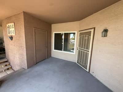 Covered entry patio creates a warm welcome while providing additional outdoor living space. This private entrance adds comfort and convenience to everyday living.