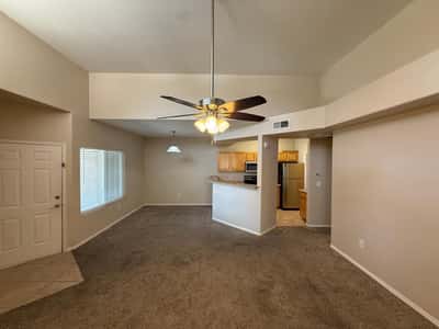 Light-filled great room with soaring ceilings and generous living space. The open design creates an airy atmosphere while maximizing functionality and comfort.