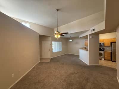 Impressive living space highlighted by vaulted ceilings and abundant natural light. The flexible layout accommodates a variety of furniture arrangements and lifestyles.