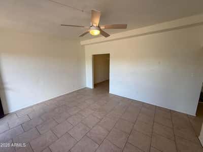 Spacious main living area offering multiple furniture arrangement options, easy-maintenance flooring, and a bright, airy feel. The open layout supports a variety of lifestyle needs and design preferences.