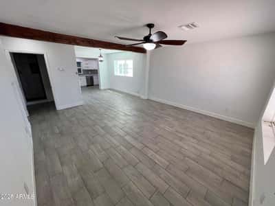 Wide-open living spaces, contemporary tile flooring, and modern finishes create a comfortable environment for entertaining and everyday life. The open layout enhances both functionality and visual appeal.