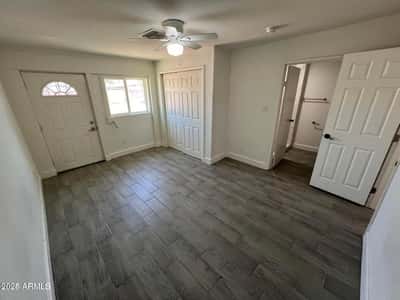 Enjoy a spacious bedroom featuring modern flooring, closet storage, and convenient bathroom access. The clean, updated design complements the home's move-in-ready condition.
