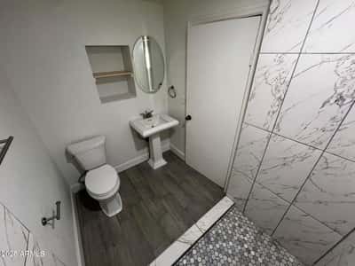 Updated with modern fixtures, attractive tile flooring, and a clean contemporary design, this bathroom offers a functional and inviting space. Recent improvements contribute to the home's fresh, move-in-ready condition.