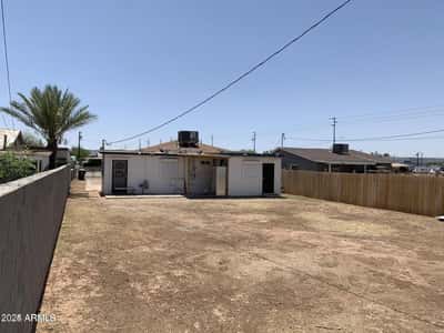 The expansive fenced backyard offers abundant space for entertaining, landscaping projects, outdoor activities, or future enhancements. This versatile outdoor area adds valuable living space to the property.