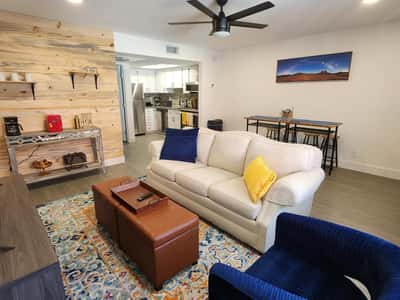 Enjoy movie nights and gatherings in this spacious living area featuring contemporary lighting, stylish finishes, and an efficient layout. The remodeled design maximizes comfort and functionality.