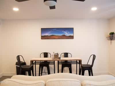 Positioned adjacent to the living area and kitchen, this dining space offers convenience and versatility for daily meals or entertaining guests. Its open placement enhances the overall functionality of the floor plan.