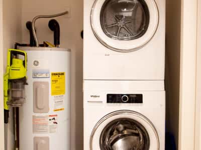Convenient in-unit laundry with stacked washer and dryer adds efficiency and practicality to everyday living. This desirable feature enhances the home's move-in-ready appeal and low-maintenance lifestyle.