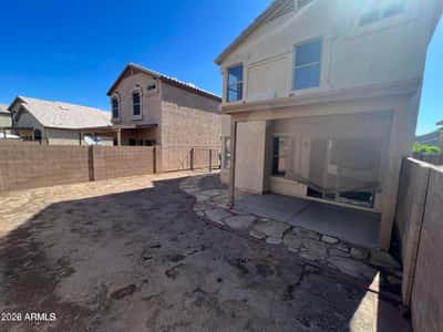 This spacious backyard offers a blank canvas for creating the outdoor retreat you've always wanted. The covered patio, privacy fencing, and generous yard area provide opportunities for recreation, landscaping, and entertaining.