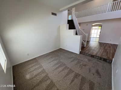 This inviting room offers comfortable carpeting and generous space for relaxation or recreation. Perfect as a family room, game room, office, or entertainment area.