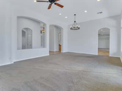 The open great room features impressive ceiling height, recessed lighting, architectural niches, and seamless flow into adjoining living areas. An inviting gathering space in this beautifully maintained Glendale home.