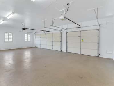 This finished three-car garage features epoxy flooring, automatic openers, bright overhead lighting, and plenty of room for vehicles, storage, or hobbies. A standout amenity in this Glendale property.