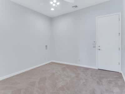 Flexible room with plush carpeting, neutral finishes, recessed lighting, and private access. Perfect as a home office, exercise room, craft room, or guest suite in this Glendale residence.