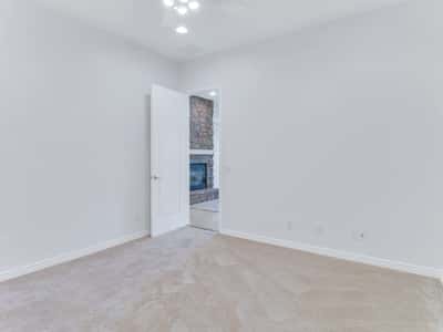 Bright bonus room featuring soft carpeting, ceiling fan, and neutral finishes. This adaptable Glendale home provides valuable extra space for work, hobbies, or overnight guests.