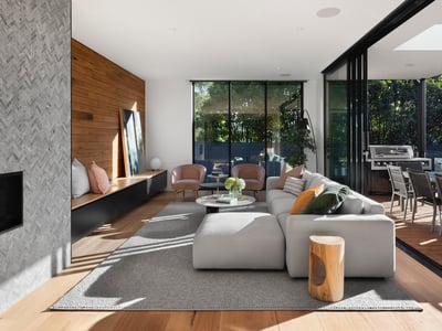 Modern living room featuring sleek design, ample natural light, and seamless indoor-outdoor flow perfect for entertaining.
