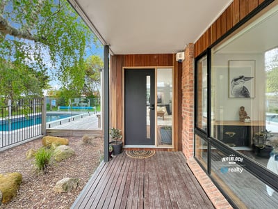 Discover modern living with a seamless indoor-outdoor flow, featuring a sleek entry and inviting surroundings.