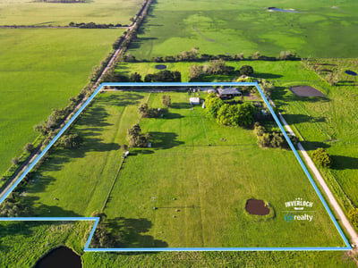 Spacious rural property featuring vast grassy fields, multiple water features, and expansive potential for development.