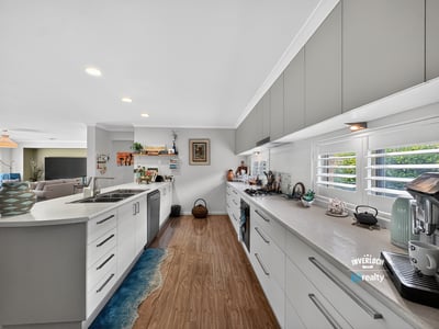 Modern kitchen featuring ample counter space, bright lighting, and a layout ideal for entertaining.