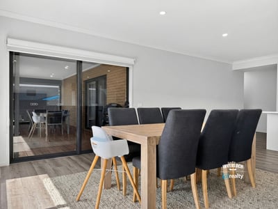 Bright dining area seamlessly connects to an outdoor space, perfect for entertaining family and friends.