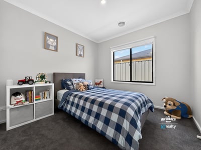 Bright, inviting bedroom featuring cozy decor, natural light, and ample space for personal touches.