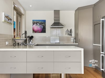 Modern kitchen featuring sleek cabinetry, high-end appliances, and an inviting layout perfect for cooking and entertaining.