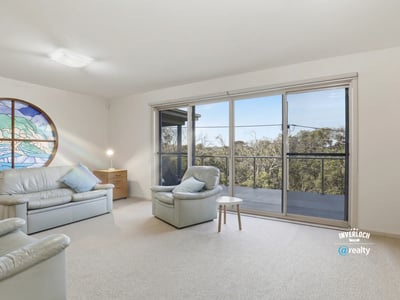 Spacious living area with panoramic views, ample natural light, and easy access to outdoor balcony space.