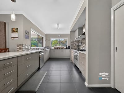 Spacious kitchen featuring modern appliances, ample storage, and natural light, perfect for culinary enthusiasts.