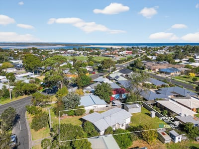Scenic coastal property with panoramic views, offering potential for development in a vibrant neighborhood.