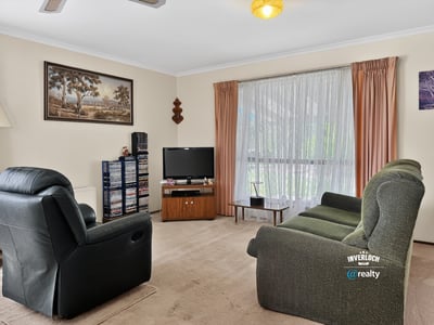 Bright and inviting living area featuring ample natural light and a welcoming atmosphere for relaxation.