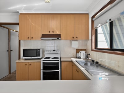 Bright kitchen features modern appliances and ample counter space, perfect for everyday cooking and entertaining.
