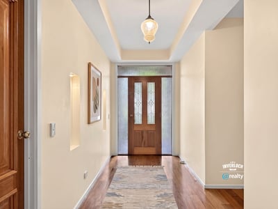 Inviting foyer with natural light, showcasing a welcoming entry that leads to the main living spaces.