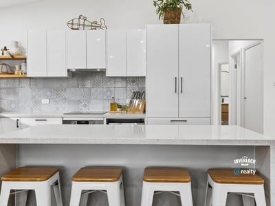 Modern kitchen featuring sleek cabinetry, a spacious island, and contemporary finishes perfect for entertaining.