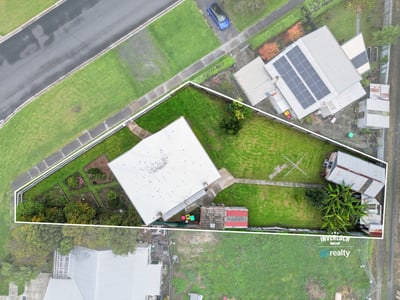 Spacious property featuring a generous yard and versatile layout, perfect for outdoor activities and potential expansions.