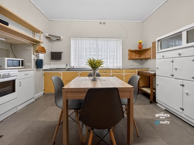 Bright and functional kitchen with modern cabinetry and ample space for dining and entertaining.