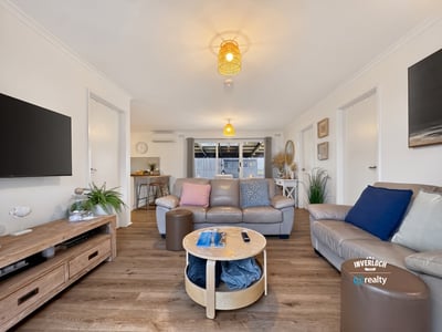 Spacious living area featuring modern amenities and abundant natural light, perfect for relaxation and entertaining.