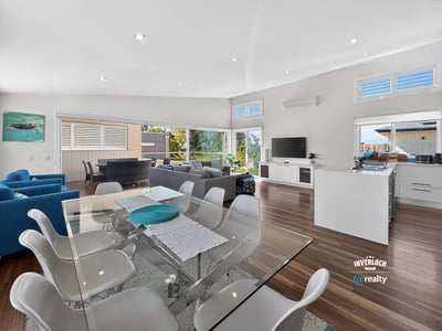 Bright and airy open-concept living space with modern furnishings and spectacular views. Perfect for entertaining.