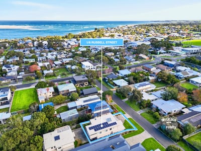Discover this coastal property with modern features and ample outdoor space, perfect for beachside living.