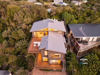 Discover this modern coastal retreat, featuring dynamic architecture and expansive outdoor living spaces surrounded by nature.