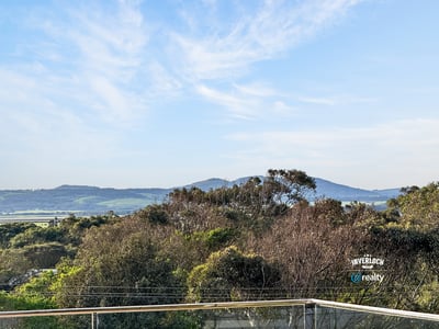 Breathtaking views of rolling hills and lush greenery create a captivating backdrop for your dream home.