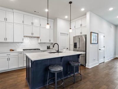 Kitchen with island and cabinets to the ceiling for extra storage