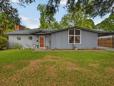 Spacious home with distinctive architecture and a landscaped yard, perfect for comfortable living and entertaining.