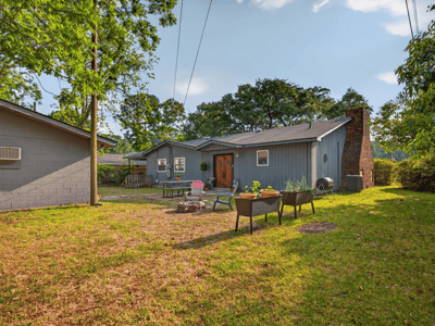 Discover a spacious backyard perfect for gatherings, featuring ample space and unique landscaping opportunities.