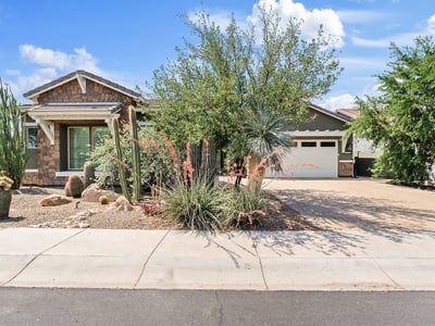 From the architectural stonework to desert garden landscaping, the front of this Phoenix home makes a warm and welcoming first impression.