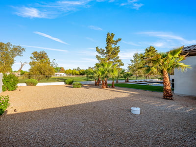A generous side yard offers potential for a guest casita, sport court, or custom outdoor living project, adding value and options.